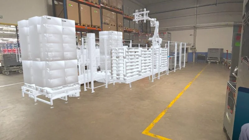 A first-person view from an XR headset of a large CAD design being virtually placed in a real factory setting using JoinXR